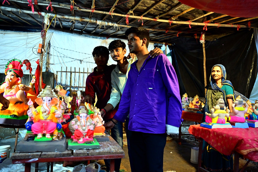 Artisans in Gulbai Tekra giving the finishing touches to a large Ganesh idol